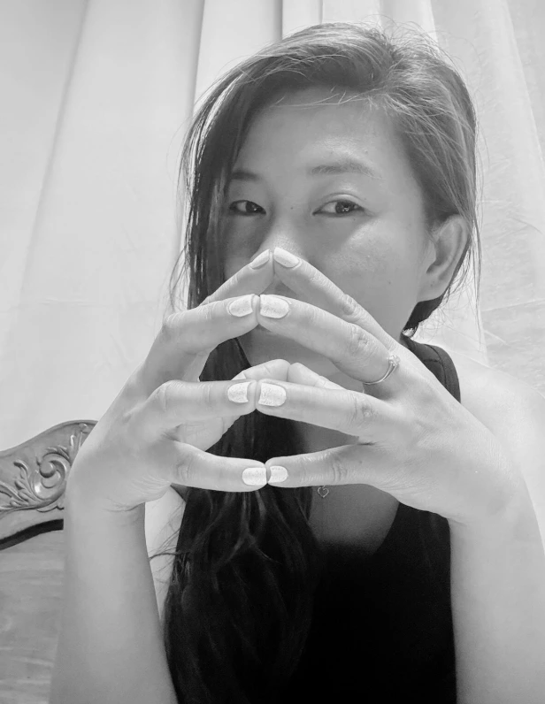 Queen Sierra with hands near her face, professional dominatrix in Manila